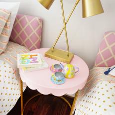 Pink and Gold Girls' Bedroom With Feminine Nightstand