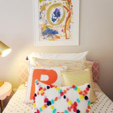 Gray Girl's Bedroom With Framed Finger Painting and Colorful Twin Bed