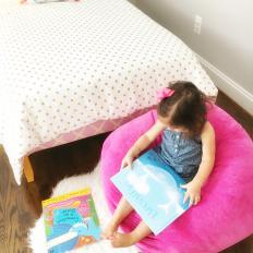 Pink and Gold Girl's Bedroom With Bright Pink Bean Bag Chair