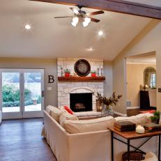 Renovated Fireplace and New Mantel Create Focal Point for Modern, Beige Living Room