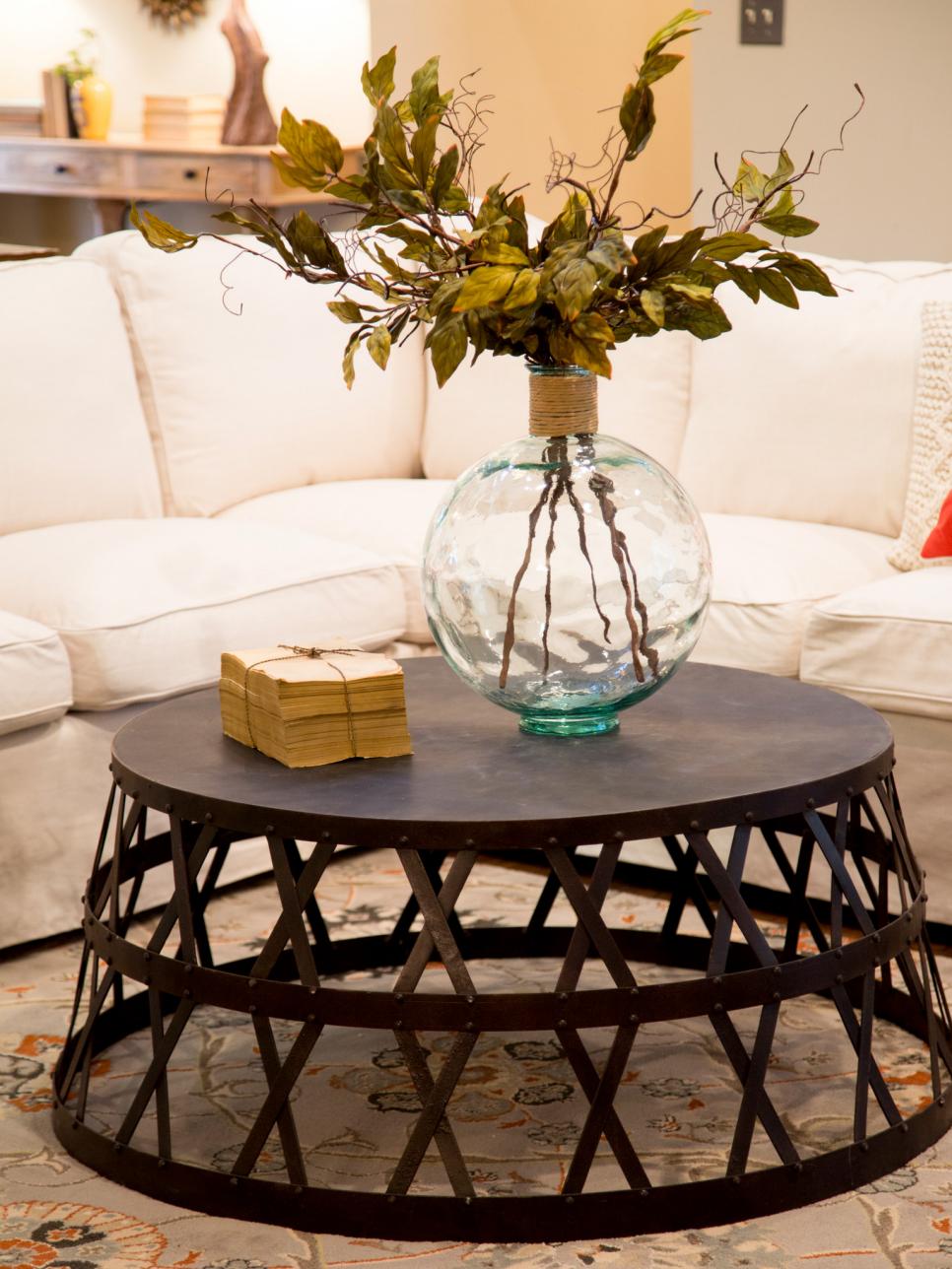 Industrial Coffee Table and Glass Vase Create Focal Point in Spacious