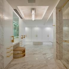 White Marble Spa Bathroom With Gold Pulls