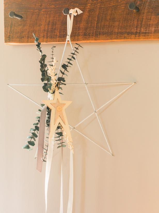 If you’re more of a minimalist, check out this gorgeous wreath with its toned down floral elements and simple ornamentation. This star wreath puts a fresh spin on a classic holiday shape!