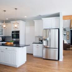 Open Kitchen with Granite Countertops and Subway Tile Backsplash