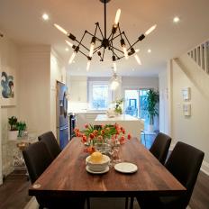 Midcentury Modern Dining Room With Classic Black and White Color Pairing and Wood Dining Table 