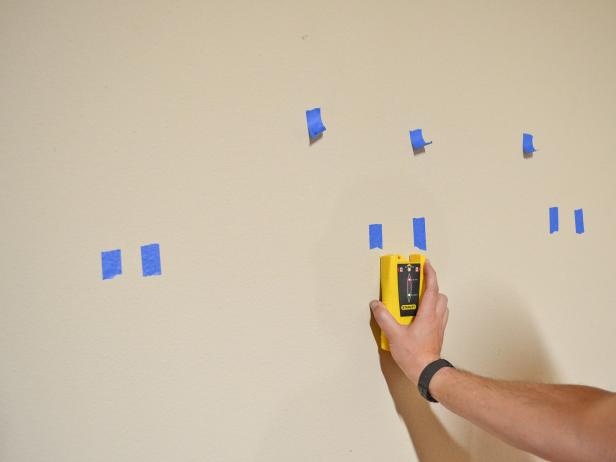 stud finder against a wall