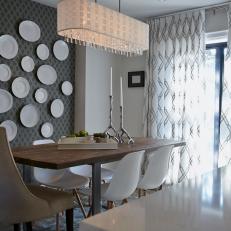 Artistic Midcentury Modern Dining Room With Wallpaper Plate Wall and Tall-Back Head Dining Chair 