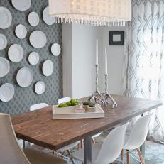 Crystal Fringed Light Fixture Over Midcentury Modern Dining Room With Plate Wall 