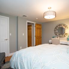Plush, Pastel Blue Comforter, Velvet Navy Armchair and Contemporary Workspace in Master Bedroom 