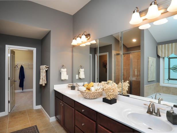 Gray Bathroom With Dark Wood Cabinets And Stained Glass Window Hgtv