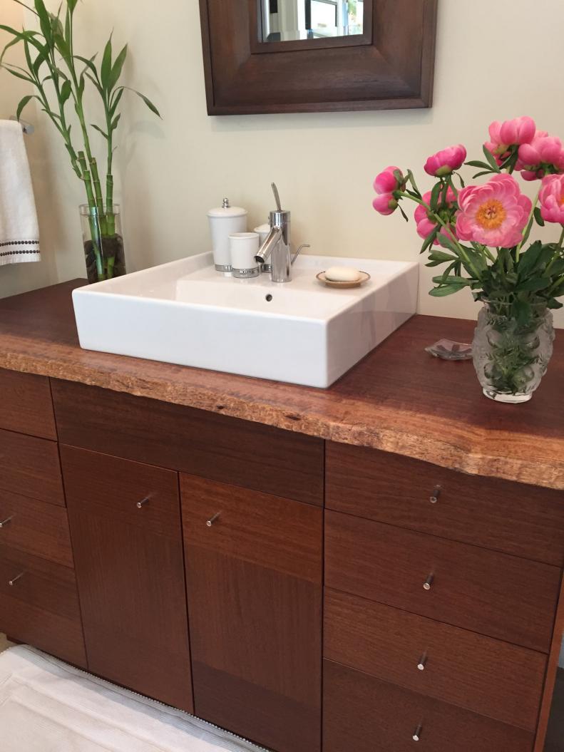 Rustic Bathroom Vanity with Live-Edge Wood Countertop and White Vessel Sink
