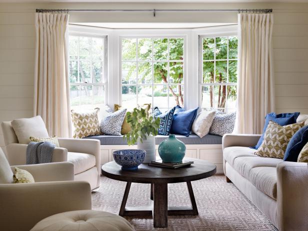 Neutral Living Room With Built-In Window Seat and Blue Accents 