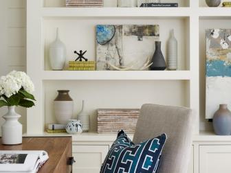 Neutral Home Office With Built-In Bookshelf and Upholstered Armchair