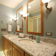 Traditional Double Vanity Bathroom With Black and White Granite Countertops
