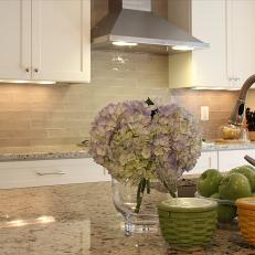 White and Neutral Kitchen With Gorgeous Purple Hydrangea Arrangement