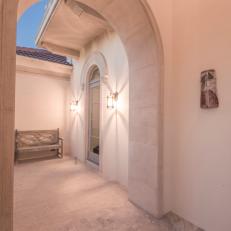 Outdoor Neutral Archway With Thick Frame By Sleek Neutral Exterior Walls Over Marble Tile Floor 
