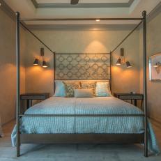 Serene, Sophisticated Bedroom With Metal Canopy Bed, Textured Throw Pillows and Contemporary Sconces 