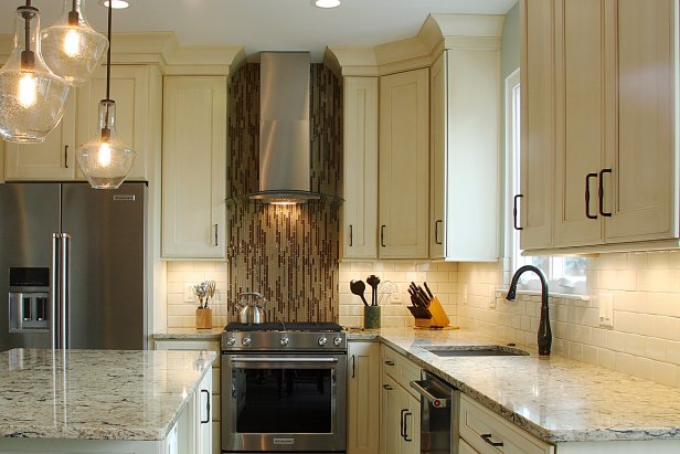 Neutral Kitchen With Brown and Tan Mosaic Tile Oven Backsplash