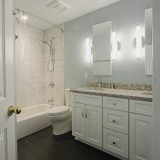 Transitional Bathroom With White Vanity and Black Floor Tiles