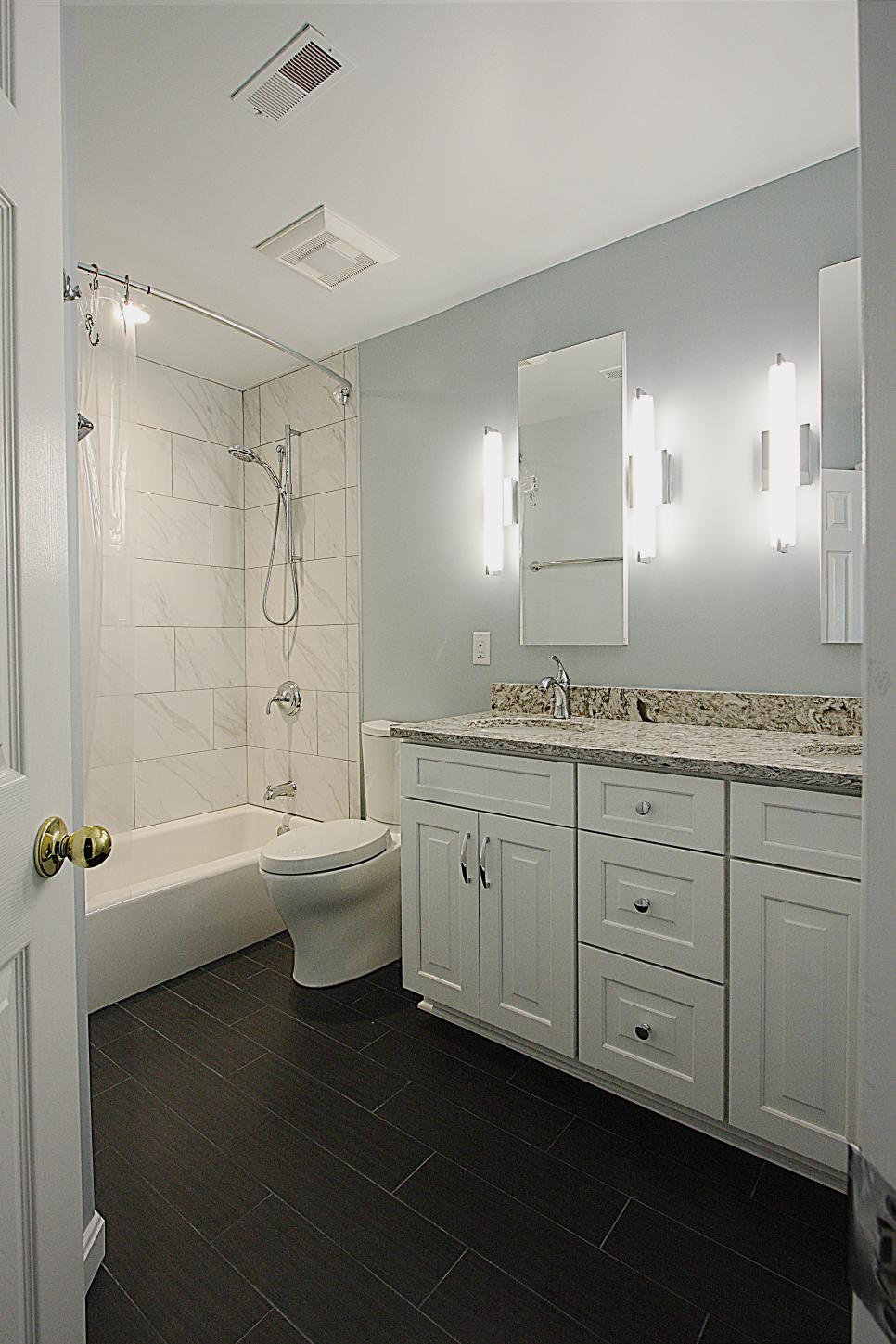 Transitional Bathroom With White Vanity and Black Floor