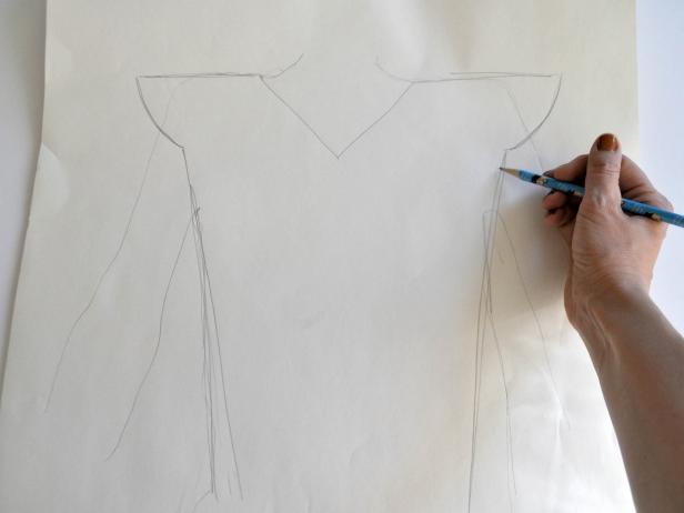 Lay the costume wearer on top of large sheet of paper and trace outline of upper body with pencil. Use outline to sketch armor. Shoulders should extend just beyond normal shoulder size and round down. Continue outline down just inside the width of the body. Extend lines 3 inches below waist. Outline pattern with marker for clarity. Cut out pattern. Tip: Fold paper in half lengthwise to ensure that the pattern created is symmetrical.