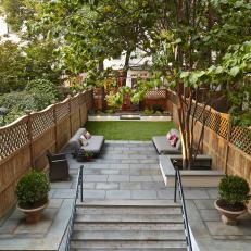 Urban Backyard With Patio and Grass