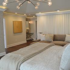 Neutral Master Bedroom With Beige Sectional