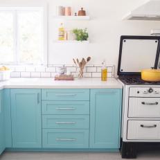 White Cottage Kitchen With Blue Cabinets