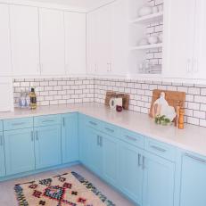 White and Blue Kitchen With Rug