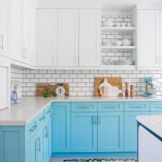 Blue and White Kitchen With Colorful Rug