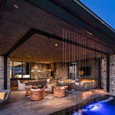 Elegant Covered Patio With Rainfall Water Feature