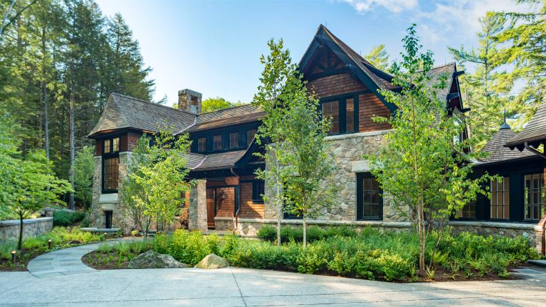 Traditional Exterior With Stone and Wood Siding