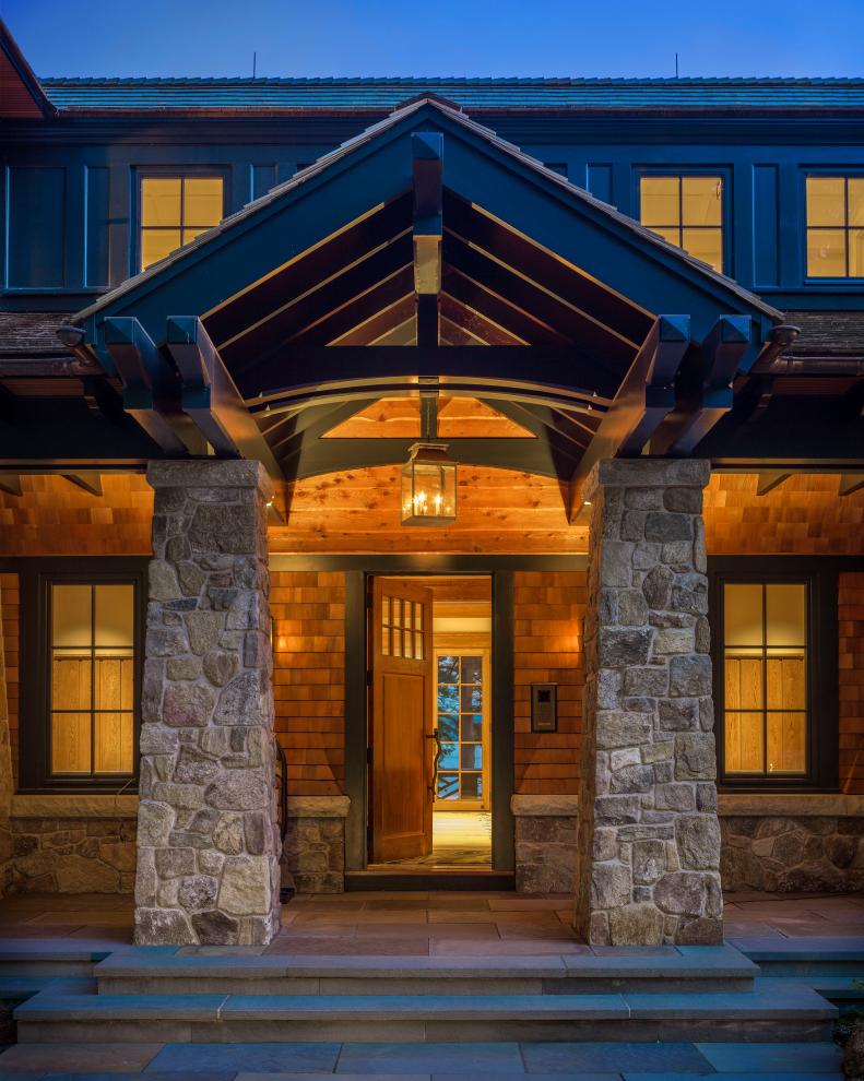 Front Entrance to Traditional Lake Home With Wood and Stone Siding