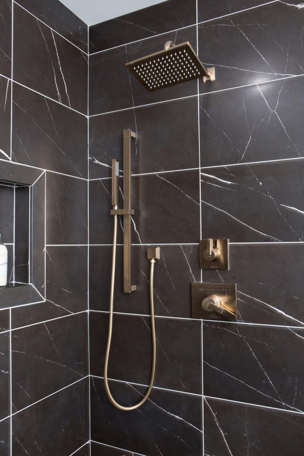 Modern Shower with Black Marble Tiles and Gold Fixtures | HGTV