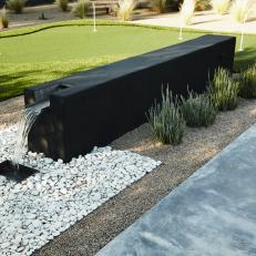 Sleek, Modern Water Feature in Redesigned Backyard