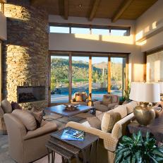 Comfy, Transitional Living Room With Stacked Stone Fireplace