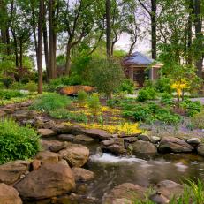 Lush Garden With Water Stream