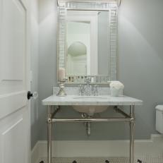 Bathroom Sink and Silver Mirror