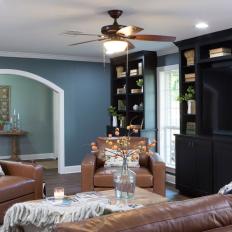 Contemporary Blue Living Room with Arched Case Openings