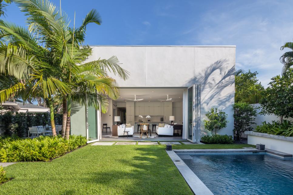 Contemporary Exterior With Pool and Palm Trees