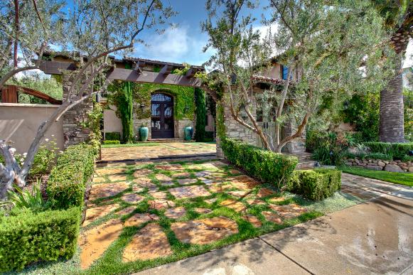 Mediterranean Front Exterior With Stone Slab Driveway