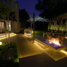 Night View of Modern Backyard With Fire Feature