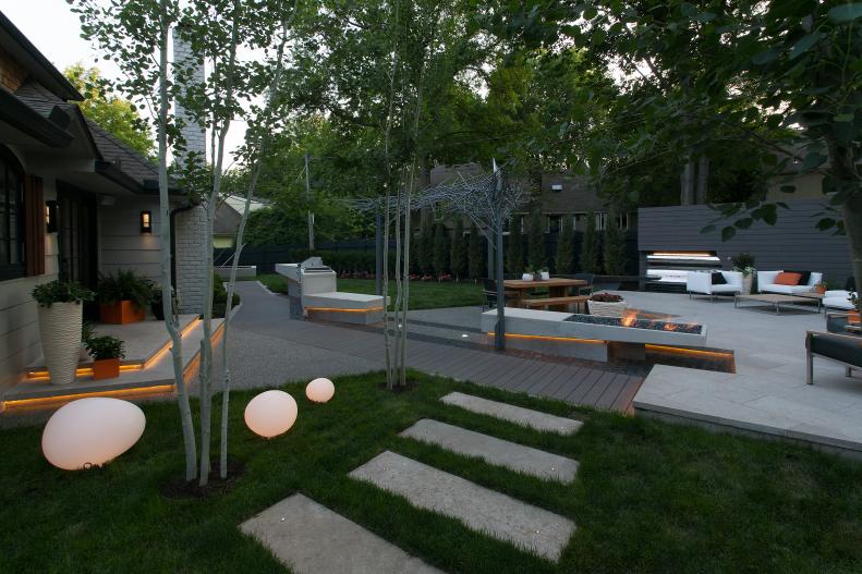 Modern Backyard With Fire Feature, Seating Area, Cove Lighting