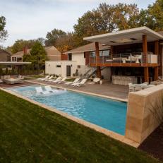 Midcentury Backyard With Pool and Lounge Seating