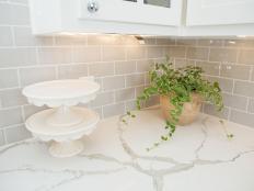 White Kitchen with Gray Tile Backsplash 