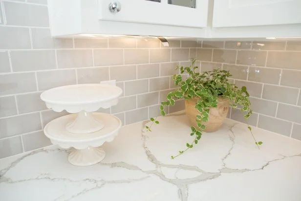 White Kitchen with Gray Tile Backsplash 