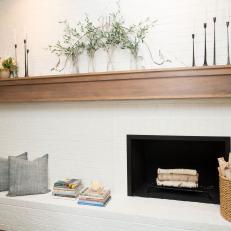 Rustic White Brick Fireplace with Brown Wood Mantel 