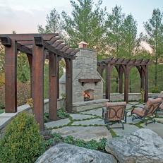 Rustic Outdoor Living Space With Stone Fireplace
