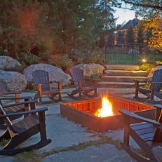 Rustic Fire Pit With Adirondack Chairs