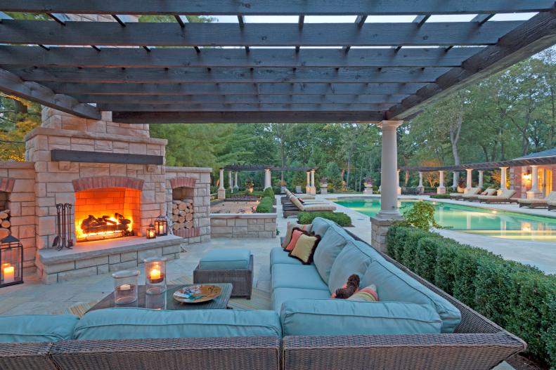 Traditional Outdoor Space With Stone Fireplace, Pergola